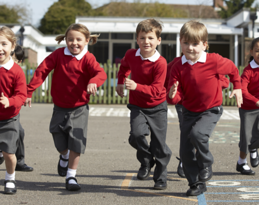 Primary School Children Running in the Playground