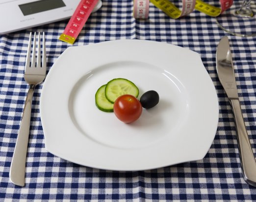 Dinner Plate with Slices of Cucumber and a Tomato 