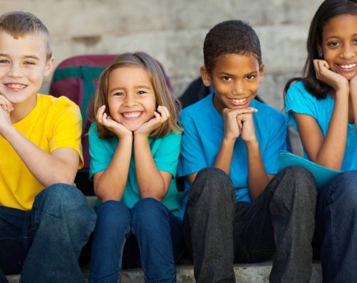 four-children-in-tshirts-smiling
