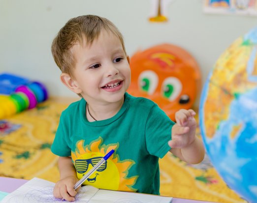 Small boy happy in the classroom