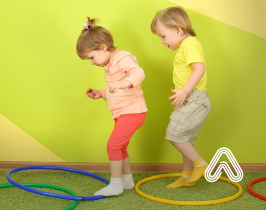 Kids playing with hula hoops fundamental movement skills