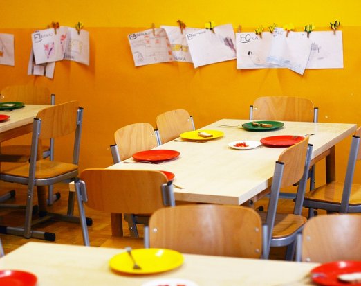 School Dining Hall with Plates Set for Lunch