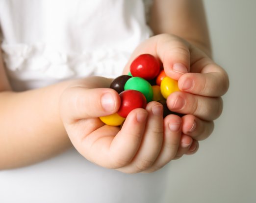 Child holding sweeties