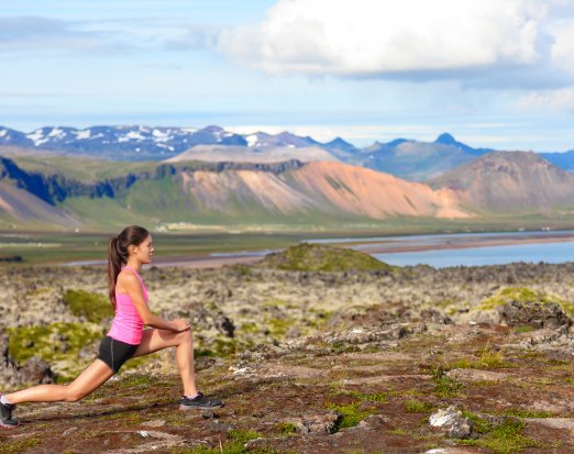woman lunging on mountain 
