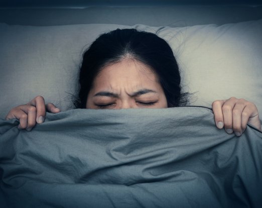 Woman struggling to get to sleep