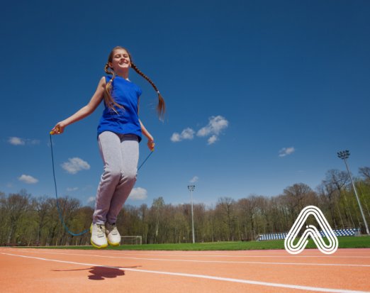 Young teen skipping with rope 