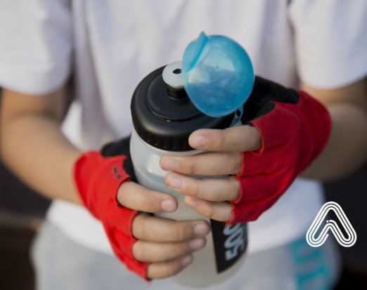 boy holding water bottle