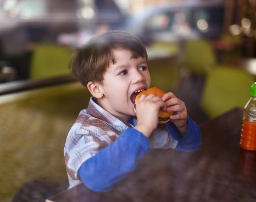 Young Boy Eating a Burger 