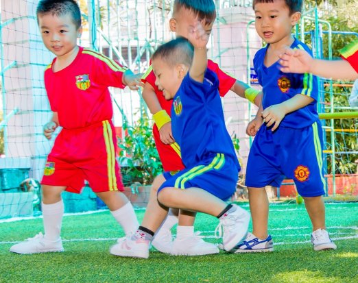 4 children playing football