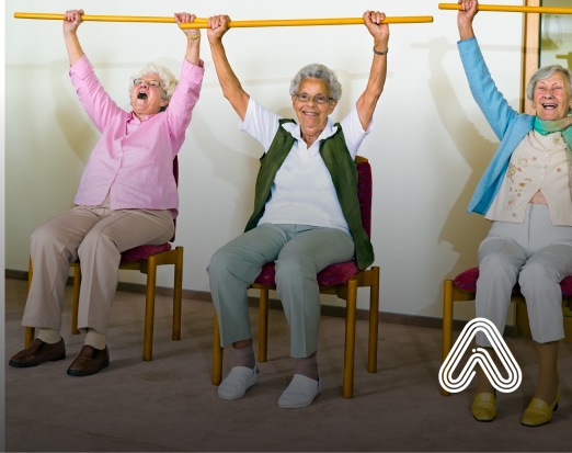 Older ladies exercising while sat down