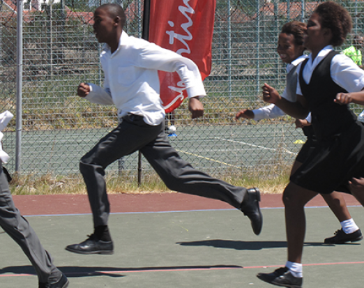 Six School Pupils in Uniform Running