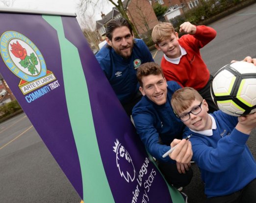 Two Blackburn Rovers Football Players Posing with Three Schoolkids 