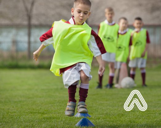 Young boy playing football Amaven 