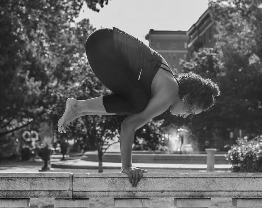 Woman balancing on a wall