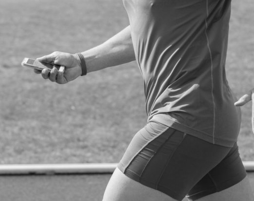 Man running with a fitness tracker