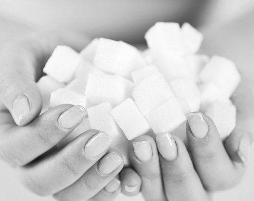 Woman holding sugarcubes