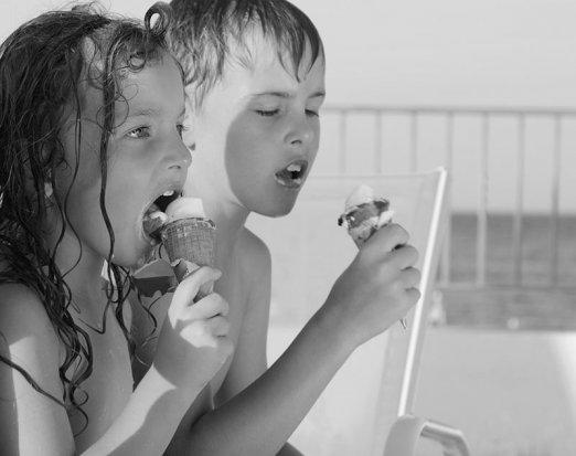 Kids eating ice cream on a beach