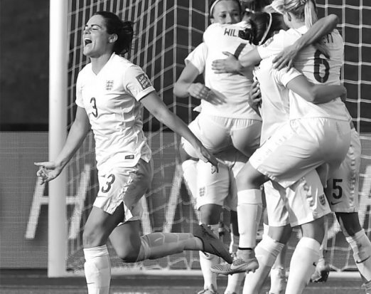 Women's football team celebrating a goal