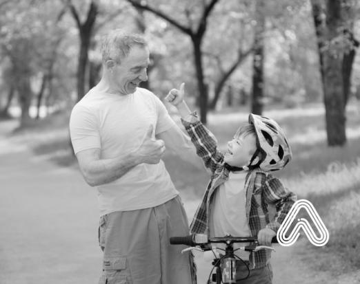 Older man and young boy with bike 