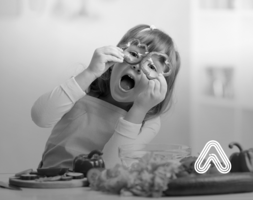 Child playing with vegetables cooking