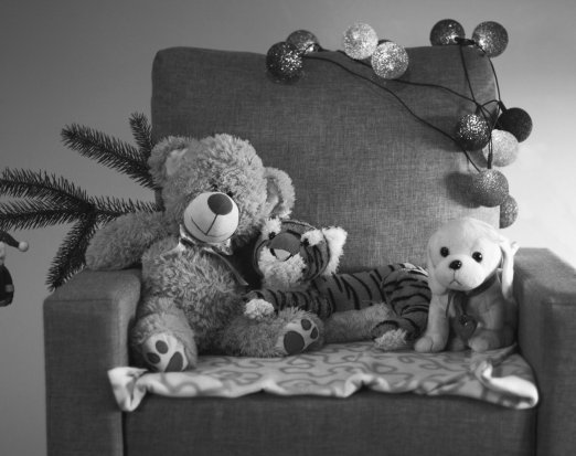 Armchair with stuffed toys and Christmas decorations