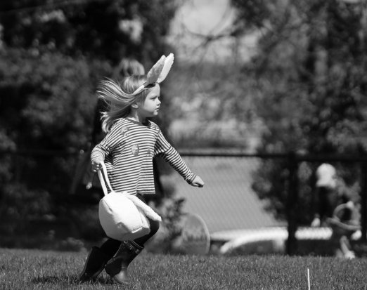 Little Girl with Bunny Ears and an Easter Basket