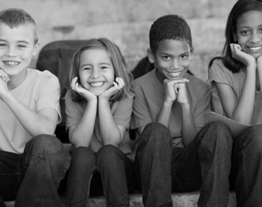 four-children-in-tshirts-smiling