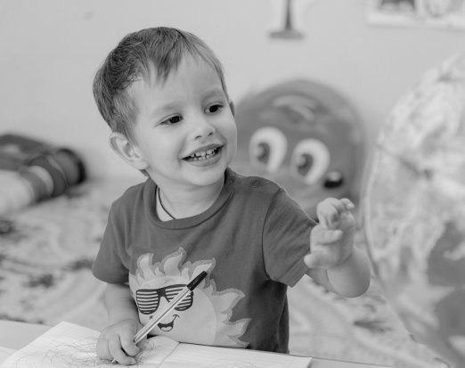 Small boy happy in the classroom