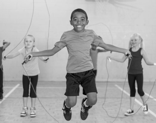 Children Playing Jump Rope in Gym Class