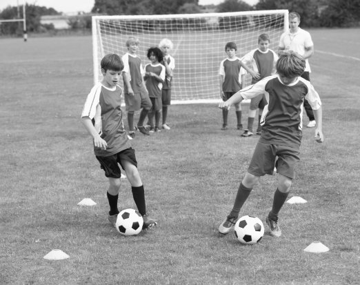 Young kids playing football