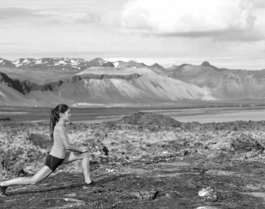 woman lunging on mountain 