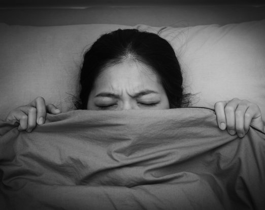 Woman struggling to get to sleep