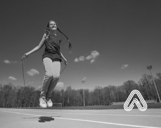 Young teen skipping with rope 