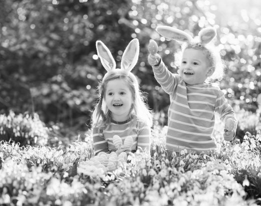 Children in forest doing Easter egg hunt