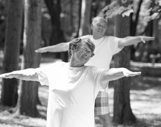 Older adults doing yoga outside