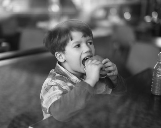 Young Boy Eating a Burger 