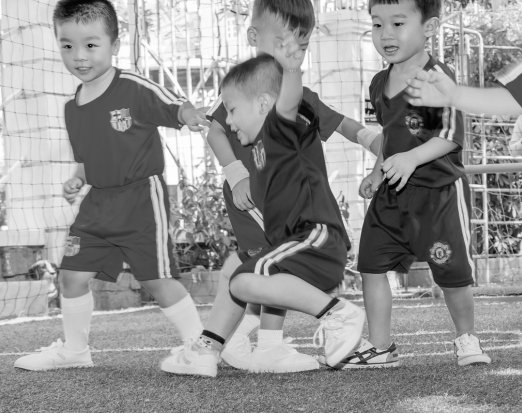 4 children playing football