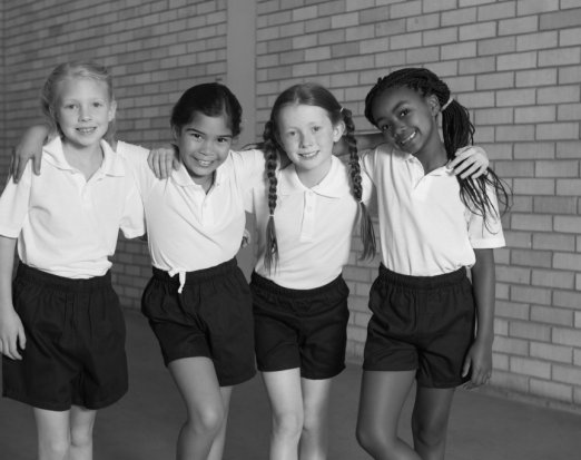 Four Young Girls Posing in School PE Kit