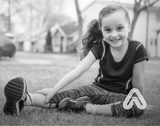 Young girl sat outside sports